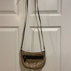 Beautiful Coach crossbody. Signature C in beige with dark brown trim.
